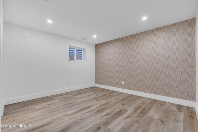 spare room featuring light hardwood / wood-style flooring