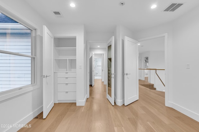 corridor featuring light hardwood / wood-style flooring