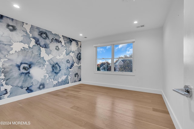 empty room with light wood-type flooring