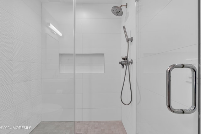 bathroom featuring an enclosed shower