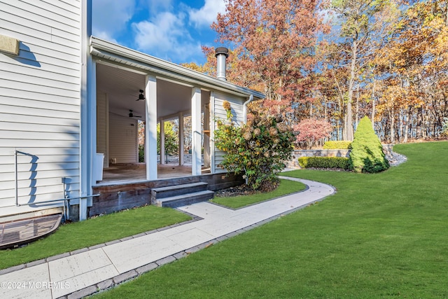 view of yard with ceiling fan