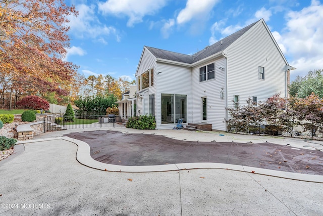 back of property with a patio area