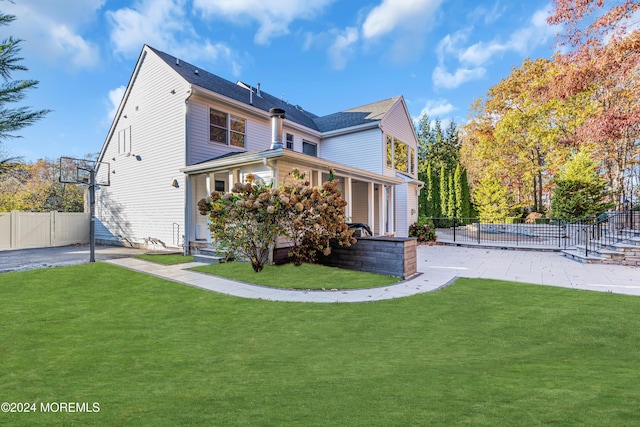 view of side of property featuring a yard