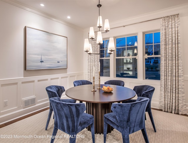 dining area with ornamental molding