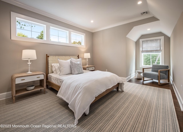 bedroom with crown molding and dark hardwood / wood-style flooring