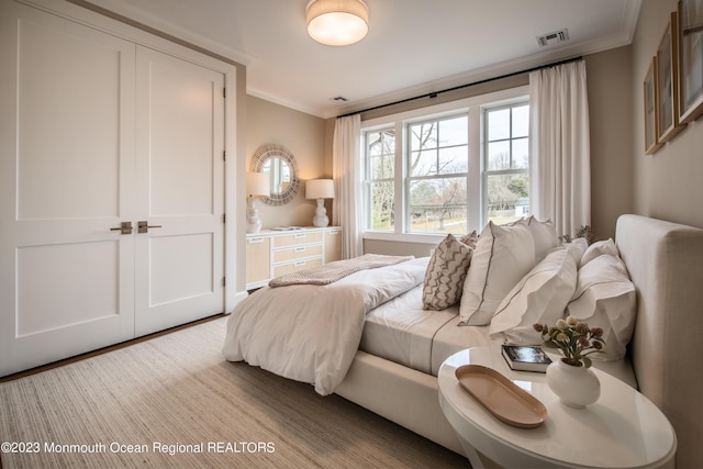 bedroom with crown molding