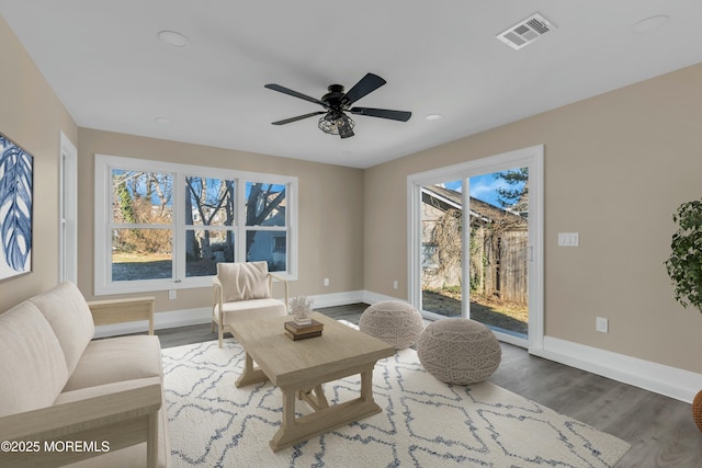 sitting room featuring ceiling fan and hardwood / wood-style flooring