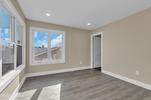 unfurnished room featuring light hardwood / wood-style flooring