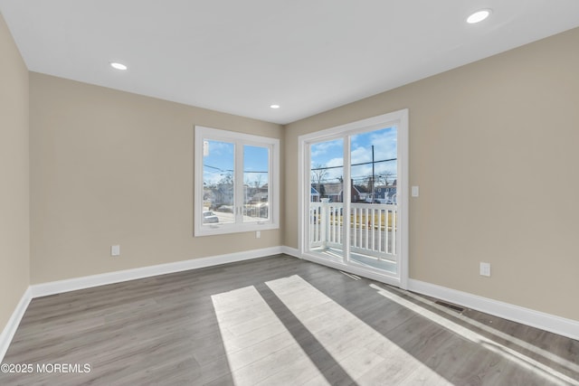 spare room featuring hardwood / wood-style floors