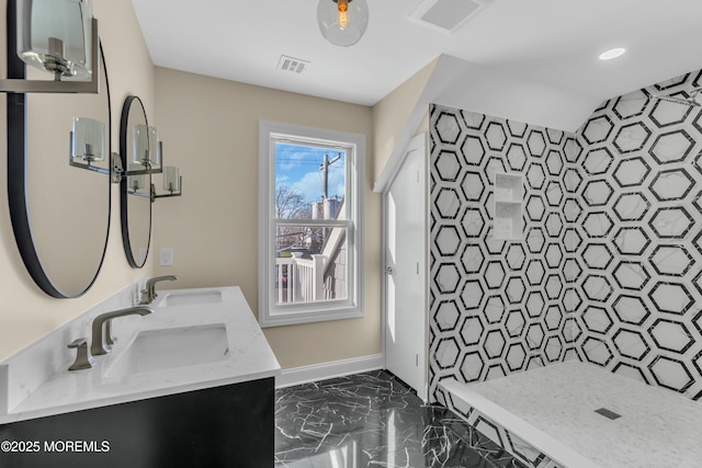 bathroom with a shower and vanity