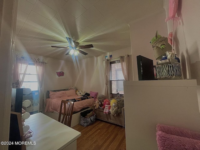 bedroom featuring ceiling fan and hardwood / wood-style flooring