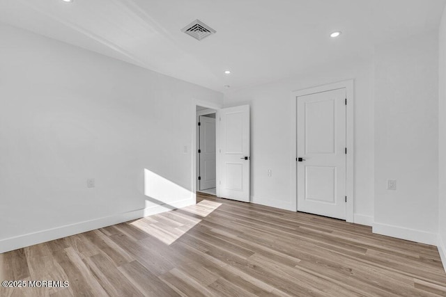 unfurnished bedroom featuring light wood-type flooring