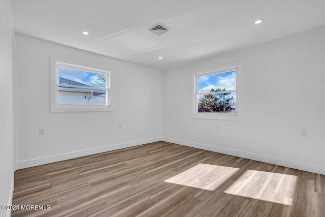 unfurnished room with light hardwood / wood-style flooring