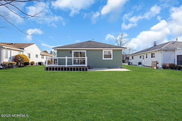 back of house featuring a yard and a patio