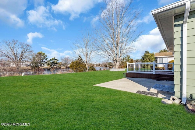 view of yard featuring a water view and a patio area