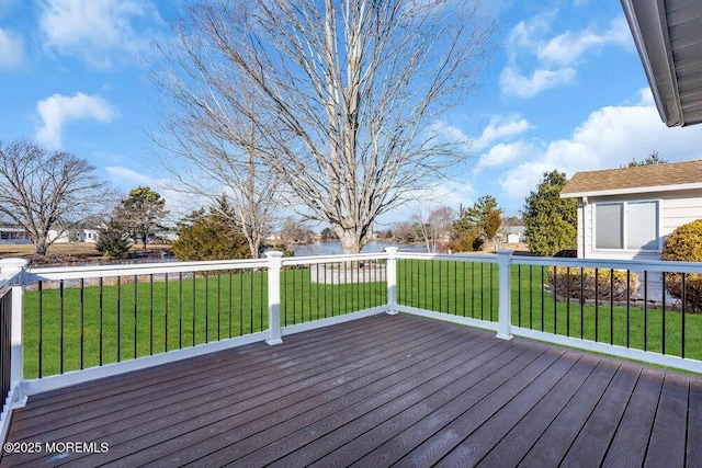 wooden terrace with a lawn