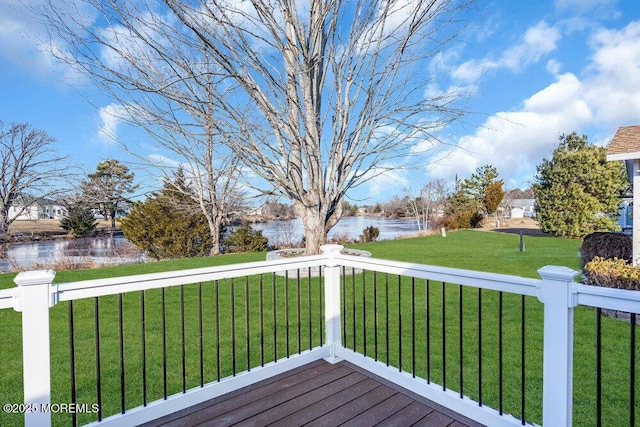 deck featuring a water view and a yard