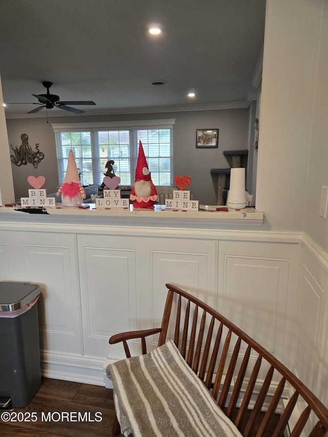 kitchen with ceiling fan, ornamental molding, and dark hardwood / wood-style flooring