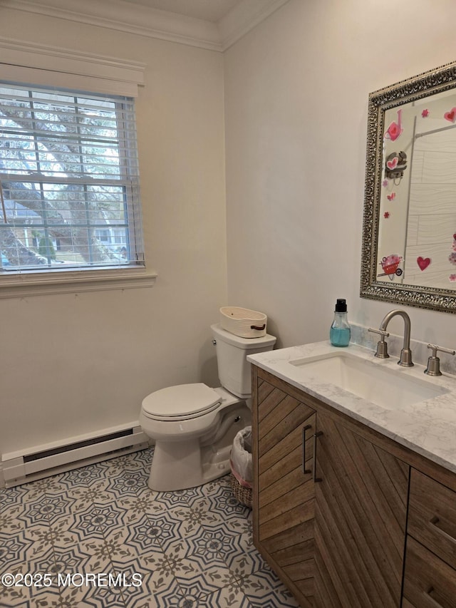 bathroom featuring toilet, vanity, tile patterned floors, ornamental molding, and a baseboard radiator