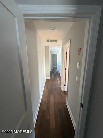 hall featuring dark wood-type flooring