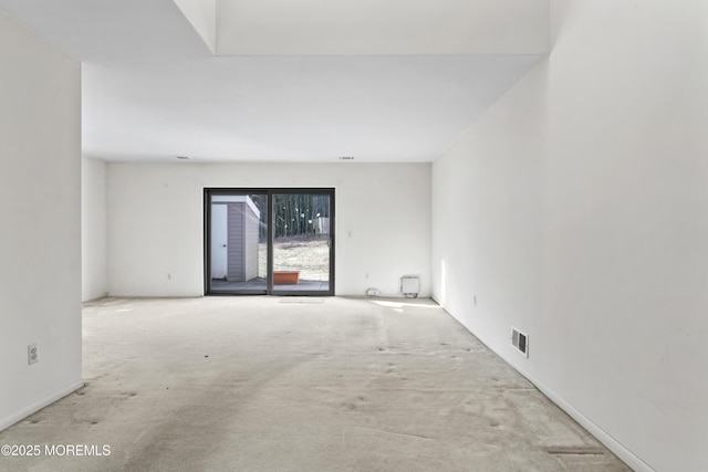 unfurnished room featuring light colored carpet