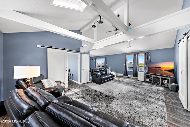 living room with ceiling fan, a barn door, lofted ceiling with beams, and dark hardwood / wood-style floors