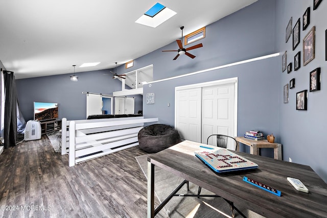 dining space featuring a skylight, hardwood / wood-style floors, high vaulted ceiling, and ceiling fan