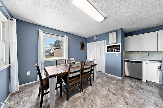 dining room with a textured ceiling