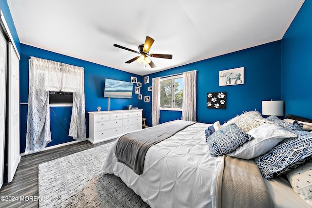 bedroom with ceiling fan, dark hardwood / wood-style flooring, and a closet