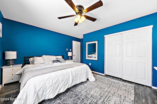 bedroom with ceiling fan, dark hardwood / wood-style flooring, and a closet