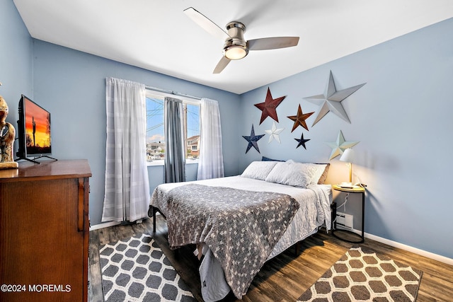 bedroom with wood-type flooring and ceiling fan