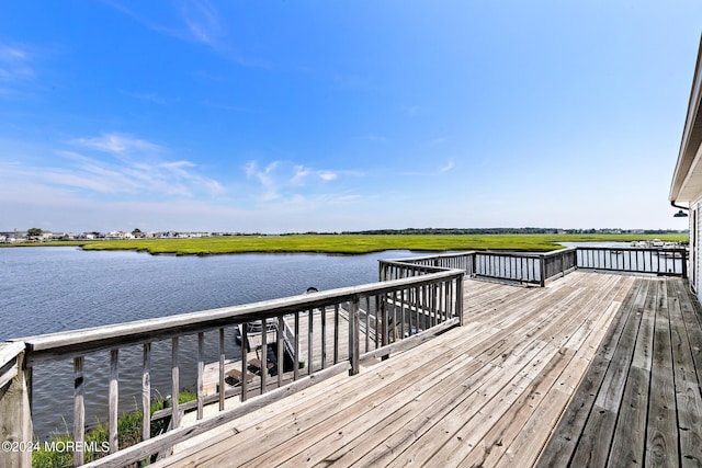 deck featuring a water view