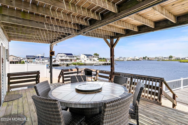 wooden deck featuring a water view