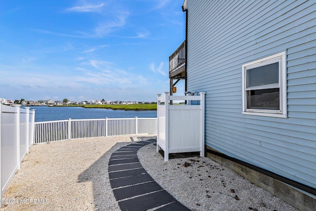 view of patio with a water view