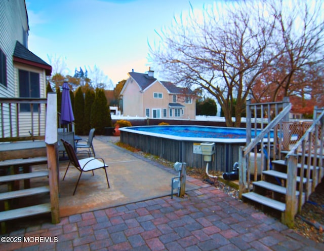 view of patio / terrace featuring a pool side deck