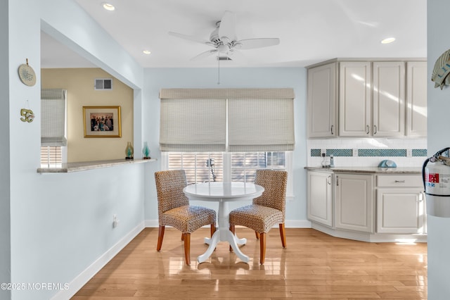 dining space featuring ceiling fan and light hardwood / wood-style floors