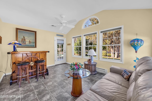 living room featuring vaulted ceiling, ceiling fan, a baseboard radiator, and a healthy amount of sunlight