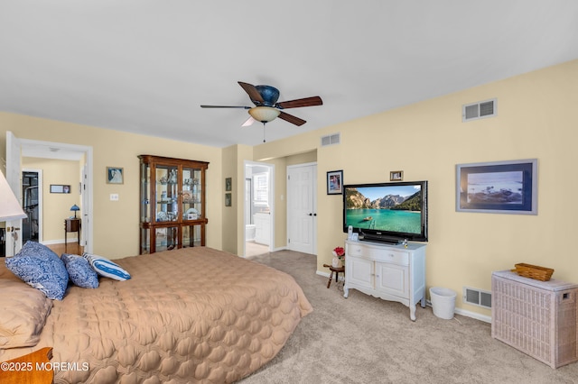 bedroom with light colored carpet and ceiling fan