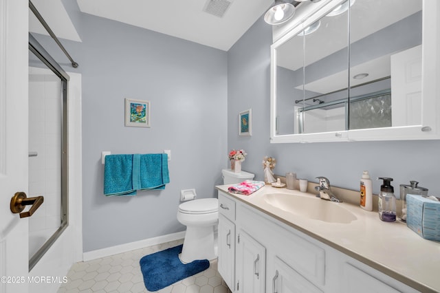 full bathroom featuring toilet, shower / bath combination with glass door, tile patterned floors, and vanity