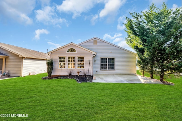 back of house featuring a yard and a patio area