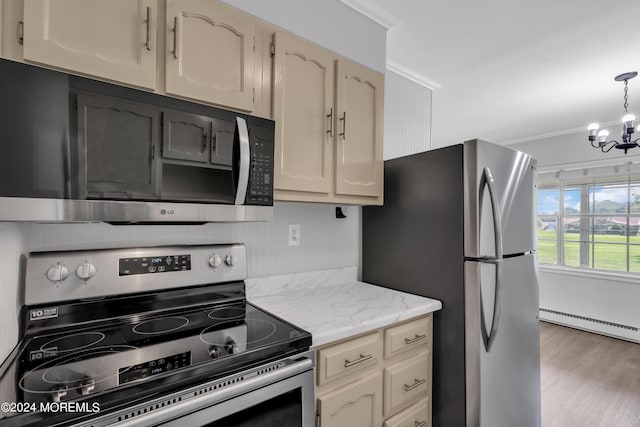 kitchen with stainless steel appliances, hanging light fixtures, ornamental molding, a baseboard heating unit, and an inviting chandelier