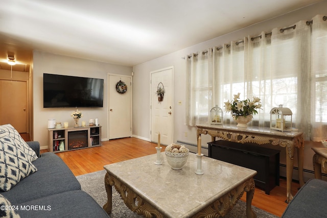 living room with a baseboard radiator and hardwood / wood-style floors