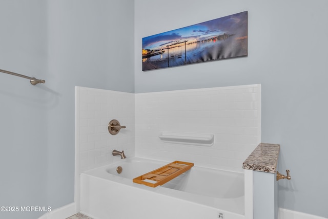 bathroom with a tub to relax in