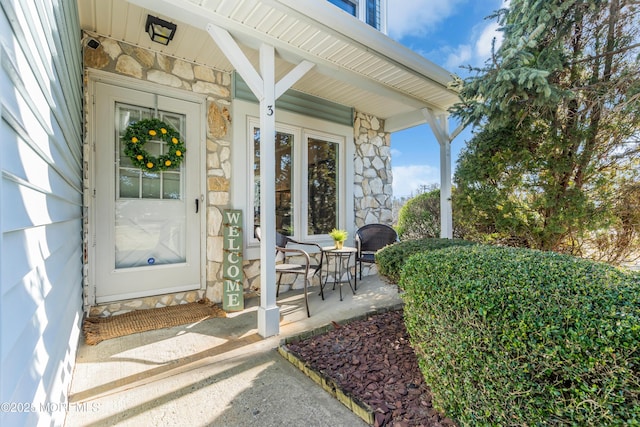 property entrance featuring covered porch