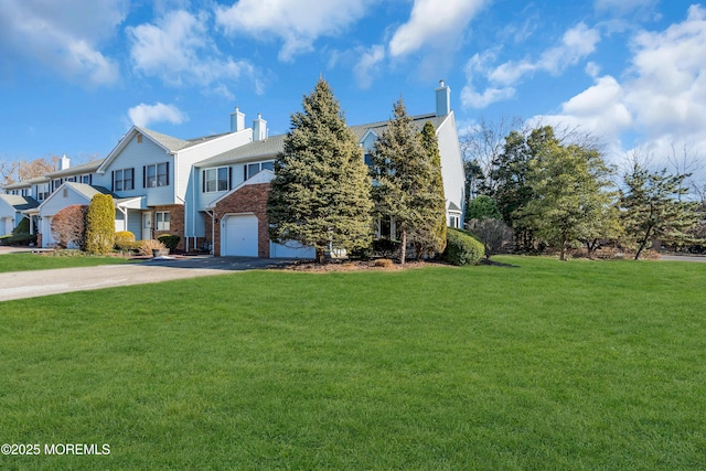 view of front facade featuring a front lawn and a garage