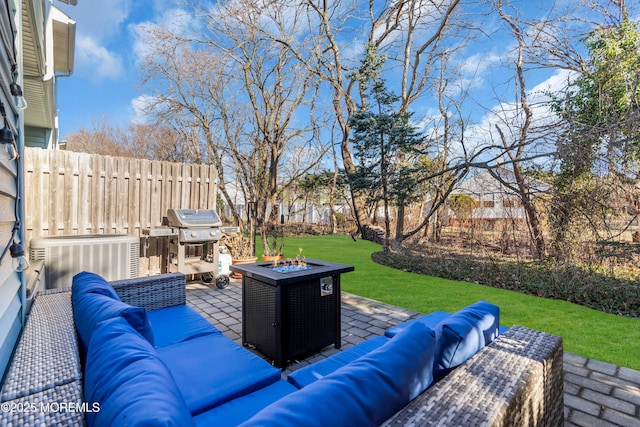 view of patio / terrace with a grill, an outdoor living space with a fire pit, and cooling unit