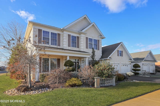 view of front of home featuring a garage, a front lawn, and covered porch