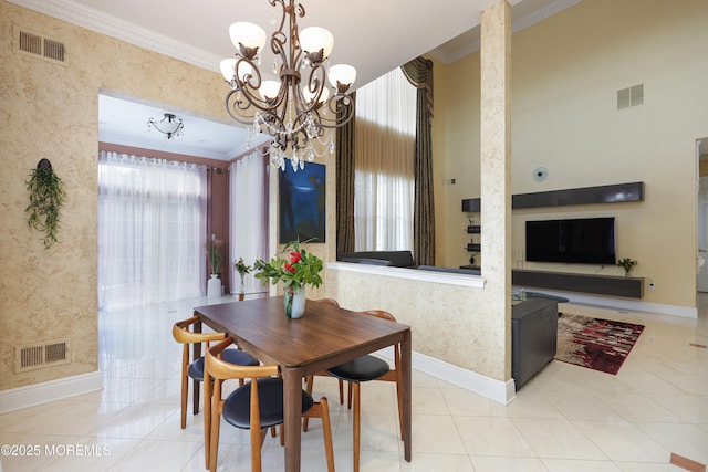 tiled dining area with crown molding and a notable chandelier