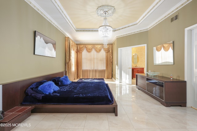 bedroom with ensuite bathroom, crown molding, and a notable chandelier