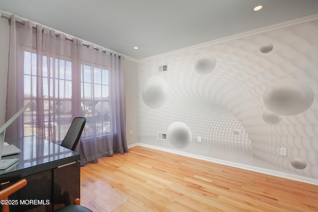 home office featuring crown molding and light hardwood / wood-style floors